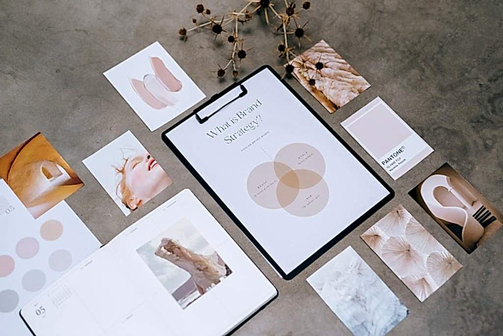 Flat lay of a minimalist brand strategy moodboard on a concrete surface. ankara kurumsal kimlik tasarimi